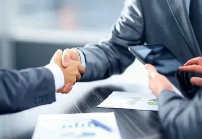 Handshake over signed loan documents